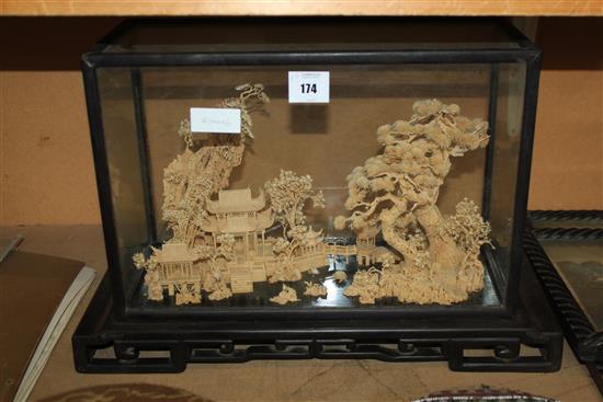 Cork carving in glass display case(-)